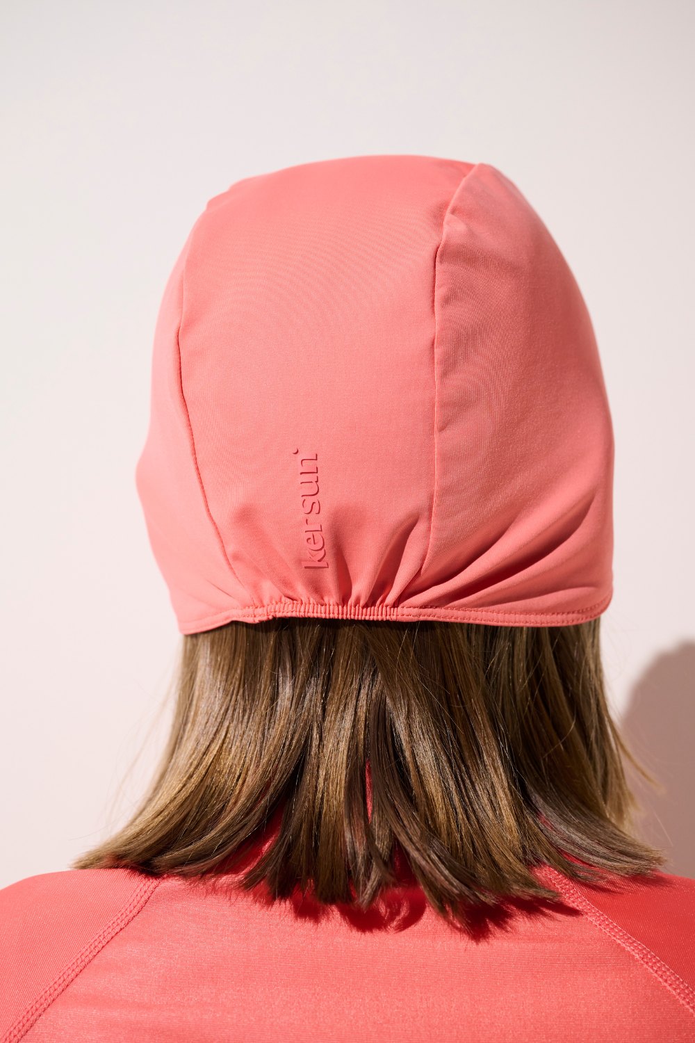 Bonnet de bain anti-UV - Pacific en rose, protection solaire UPF 50+ pour femmes, léger et élégant.