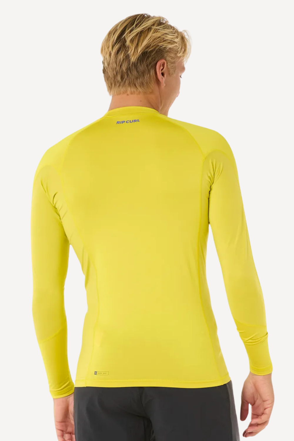 T-shirt de bain anti-UV jaune pour homme, manches longues, protection solaire UPF 50+ et tissu léger Rip Curl.